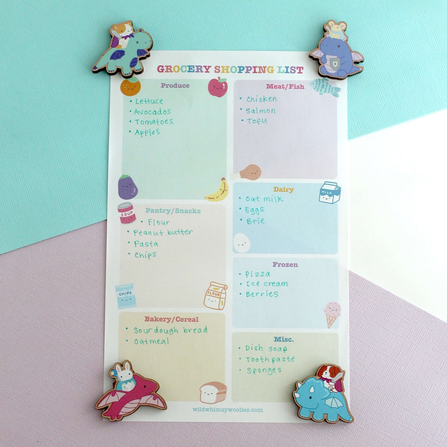 Grocery shopping list with colourful dragon knight wooden magnets on a pastel background