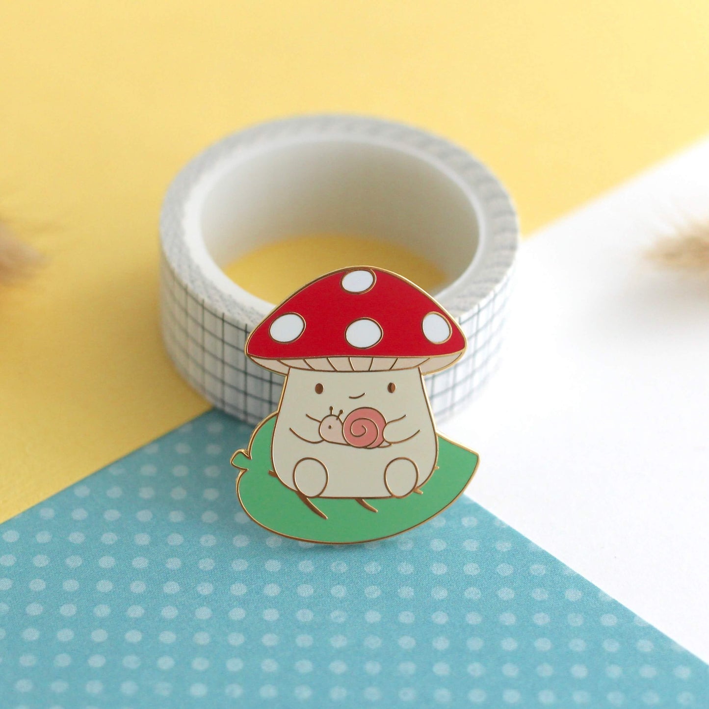 Mushroom on Leaf and holding a Snail Enamel Pin