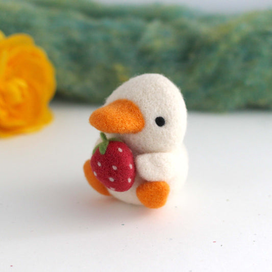 Needle Felted Duck holding a Strawberry