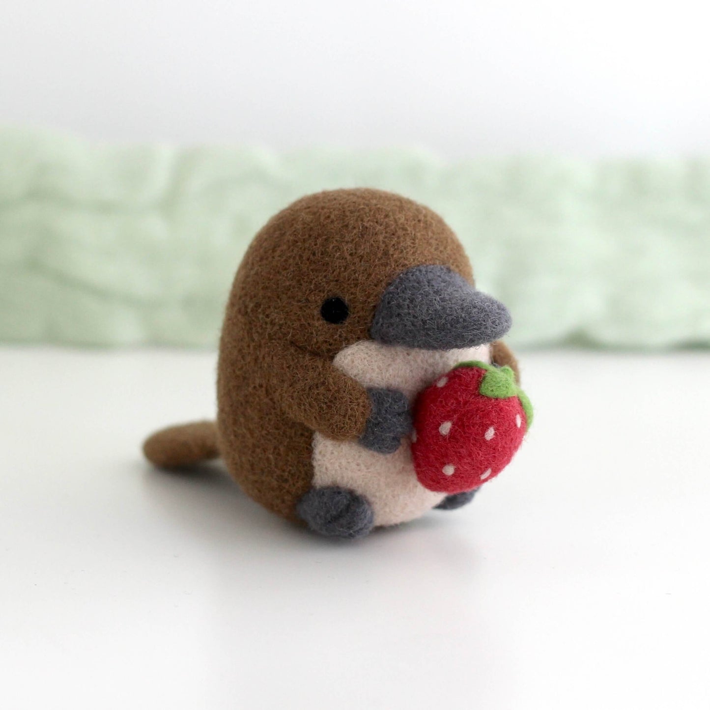 Needle Felted Platypus Holding Strawberry