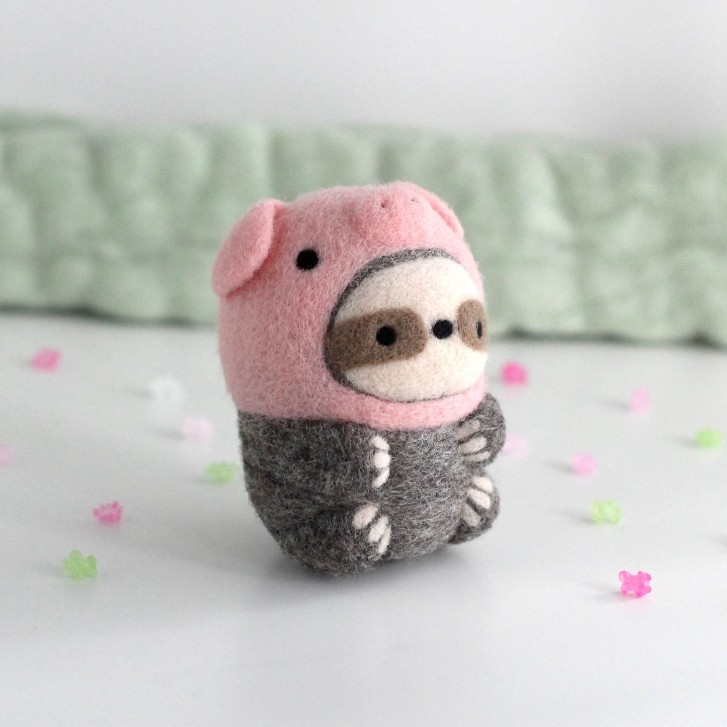 Needle Felted Sloth in Piggy Costume