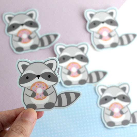 Raccoon holding Donut Vinyl Sticker