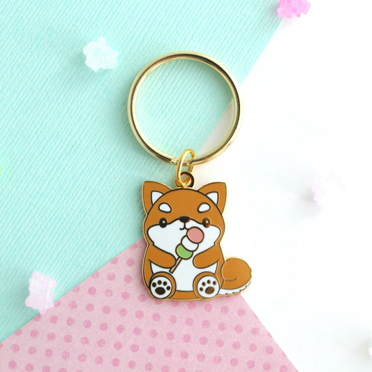 Shiba Inu holding a Dango Enamel Keychain: Circle Key Ring