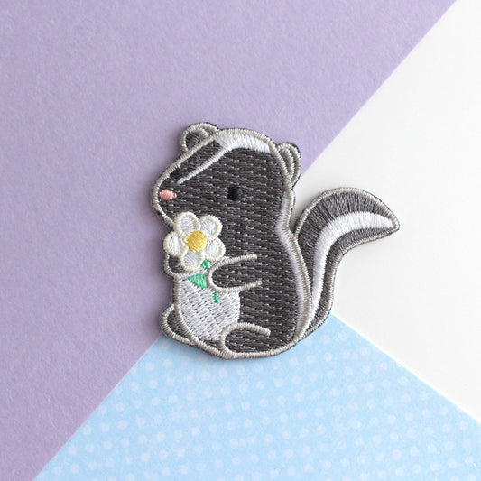 Skunk and Daisy Embroidered Iron-On Patch