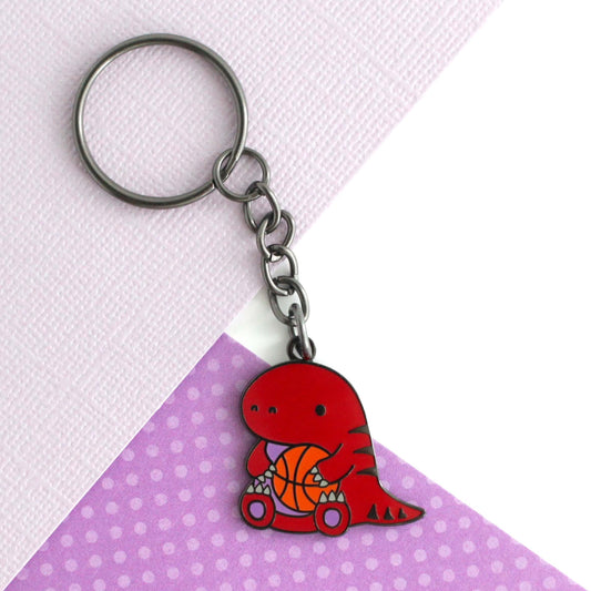 Toronto Raptor holding a Basketball Enamel Keychain