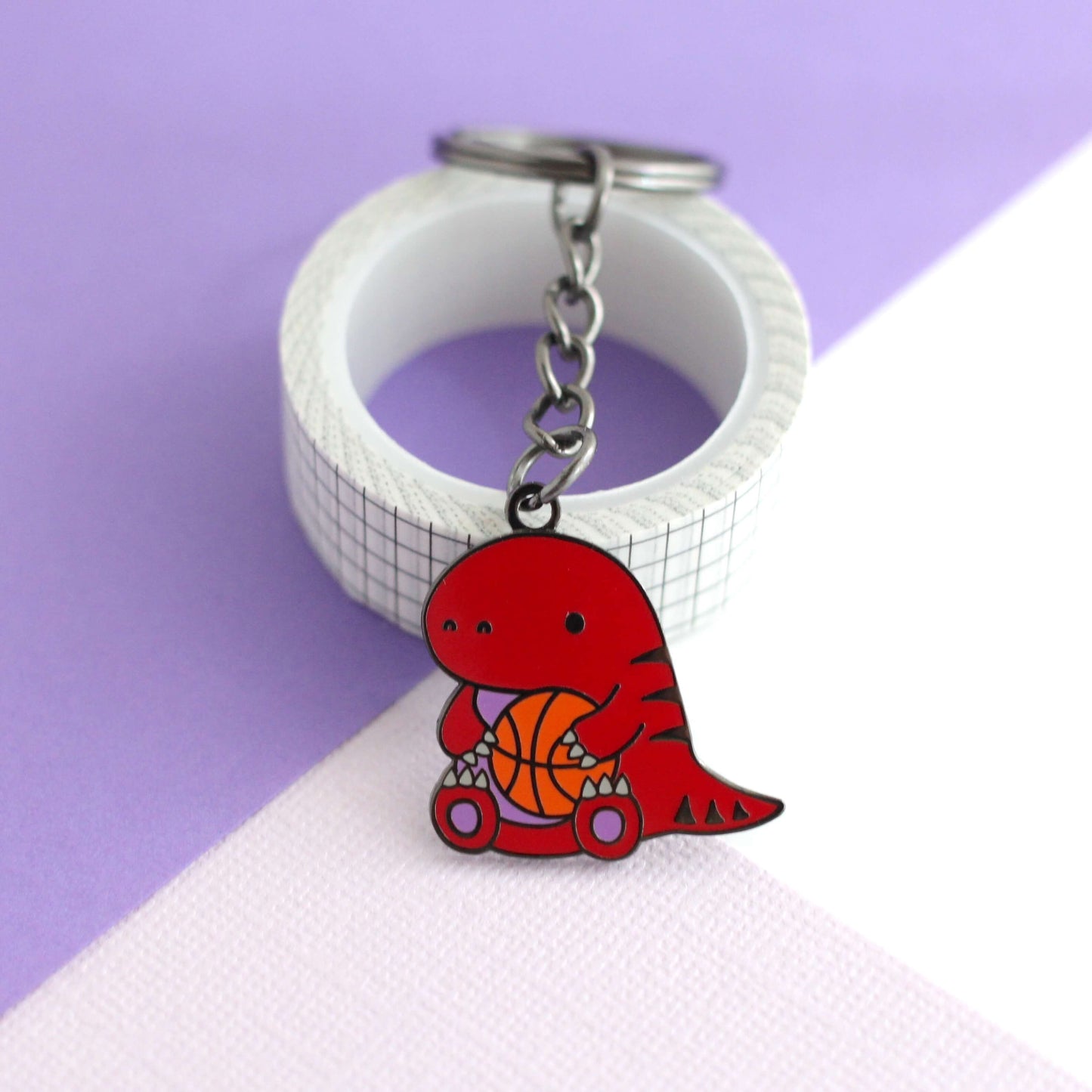 Toronto Raptor holding a Basketball Enamel Keychain