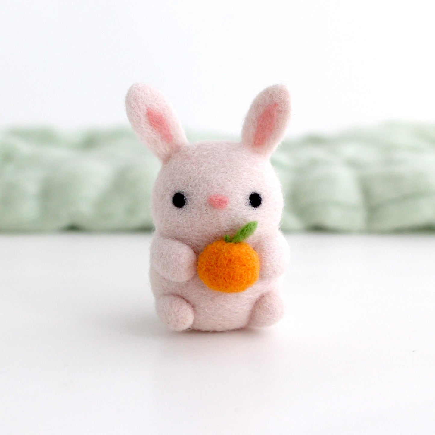 Needle Felted Bunny Holding an Orange