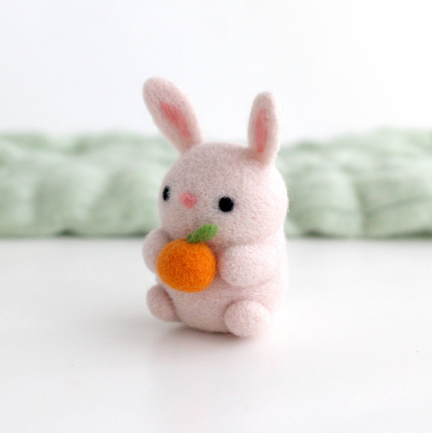 Needle Felted Bunny Holding an Orange
