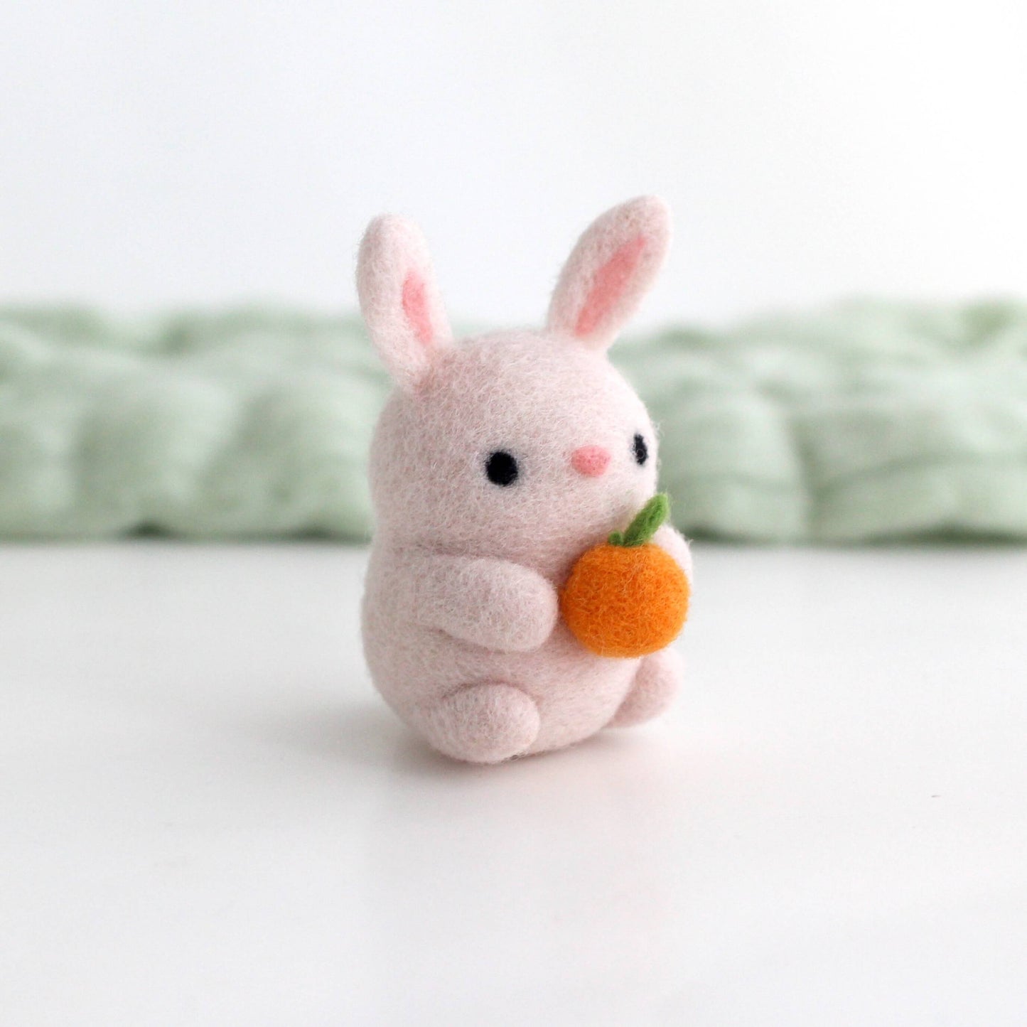 Needle Felted Bunny Holding an Orange