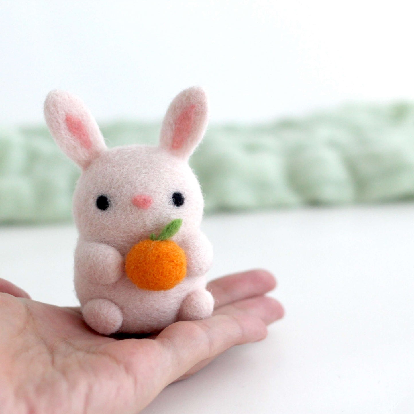 Needle Felted Bunny Holding an Orange