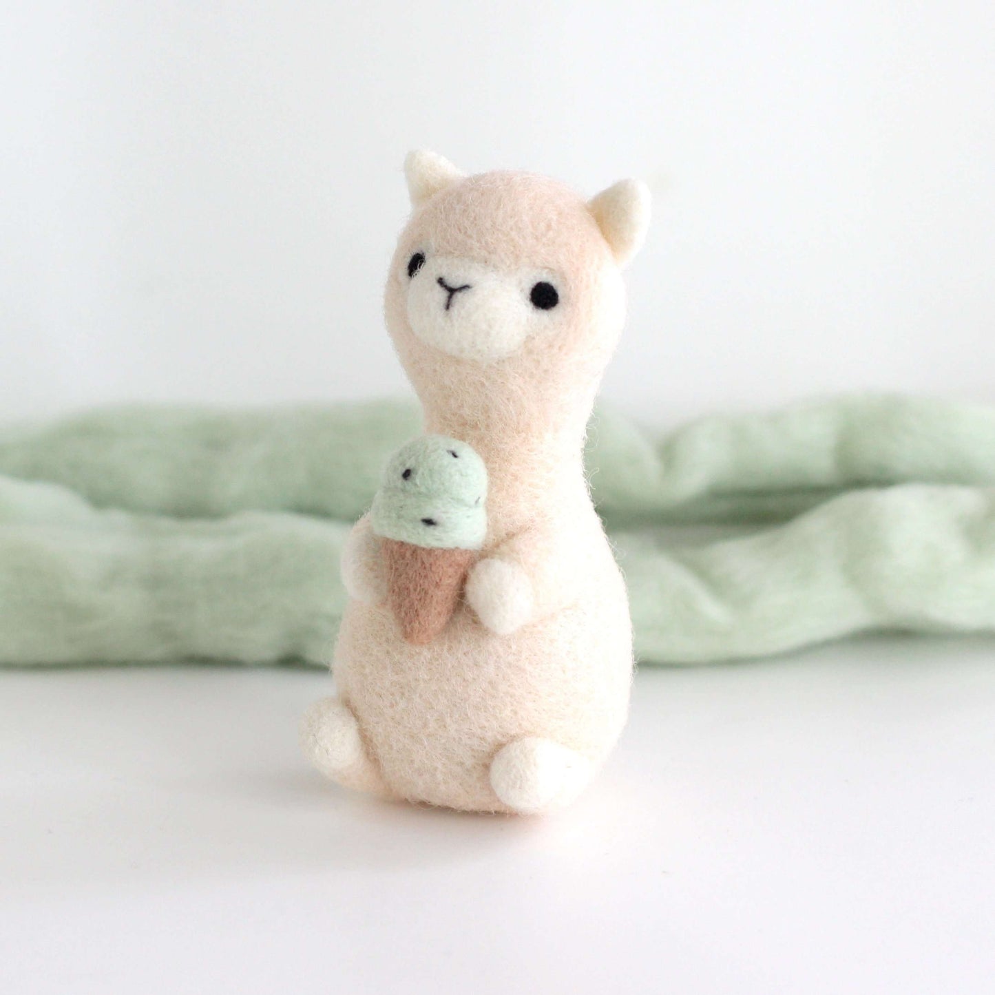 Needle Felted Alpaca holding Mint Chocolate Ice Cream