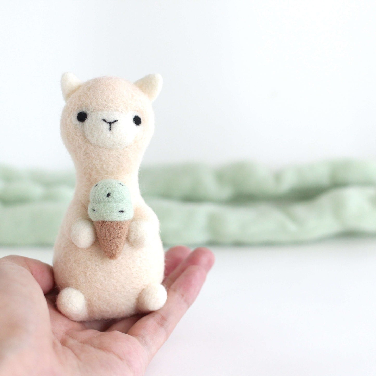 Needle Felted Alpaca holding Mint Chocolate Ice Cream