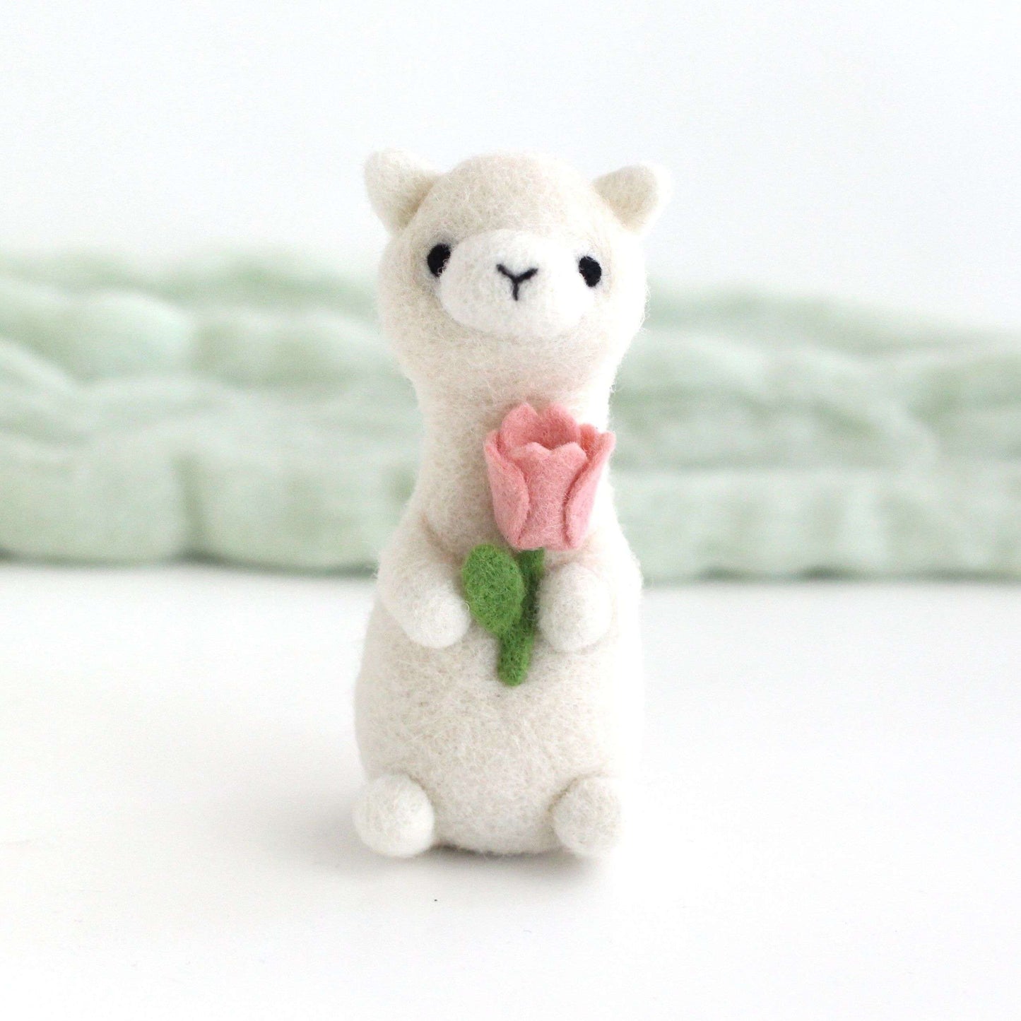 Needle Felted Alpaca holding Pink Tulip