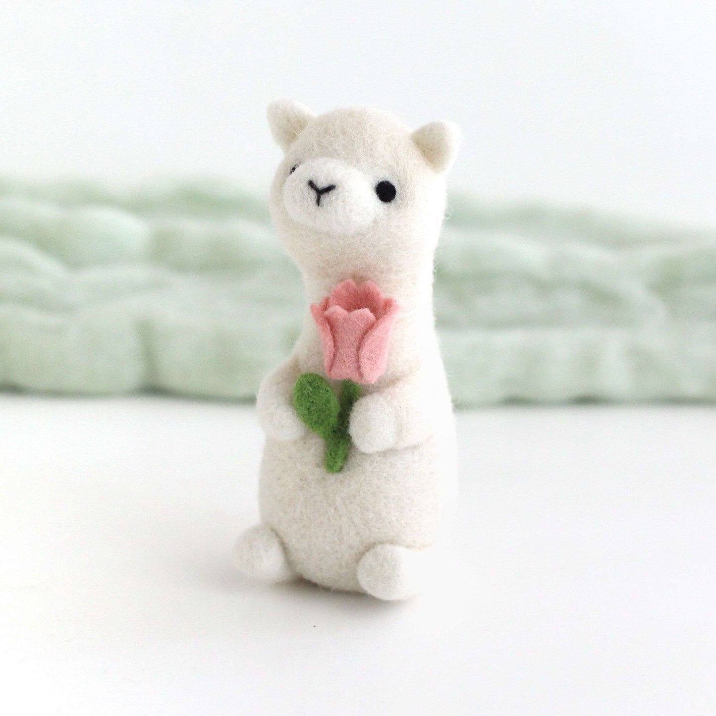 Needle Felted Alpaca holding Pink Tulip