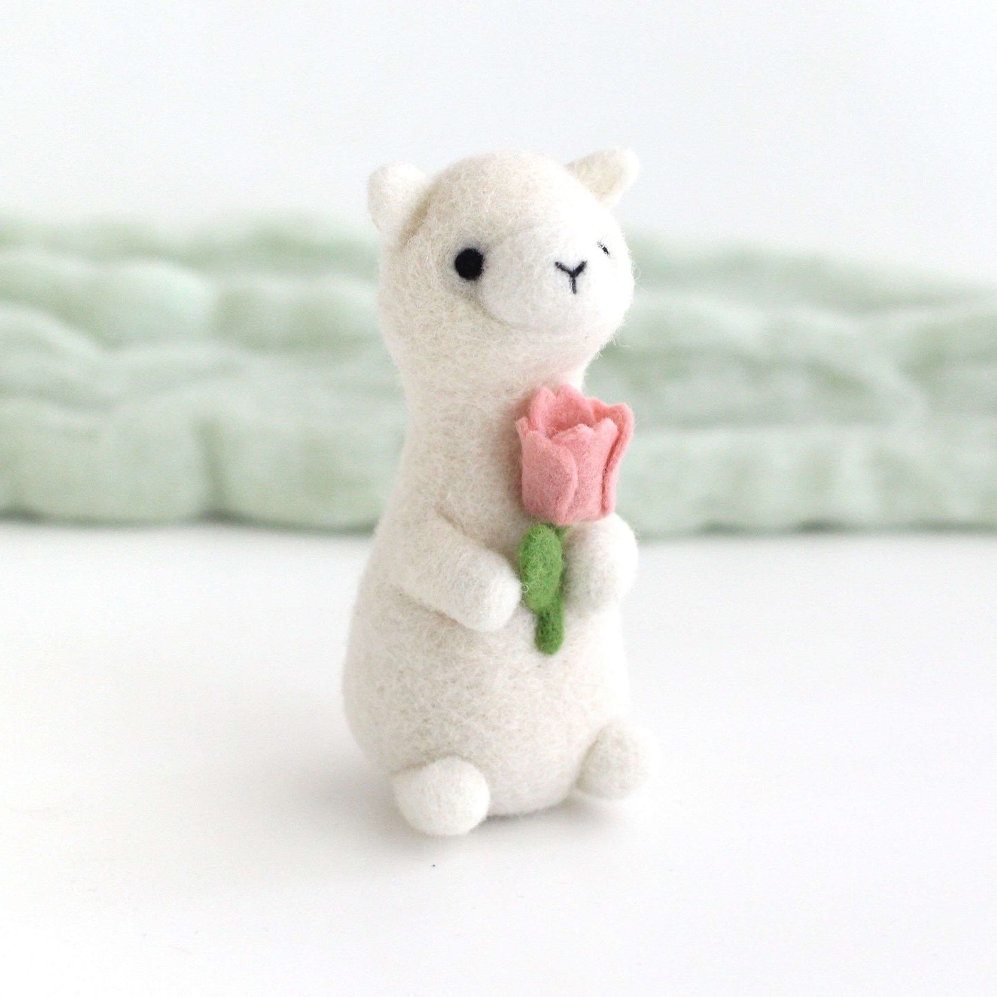 Needle Felted Alpaca holding Pink Tulip