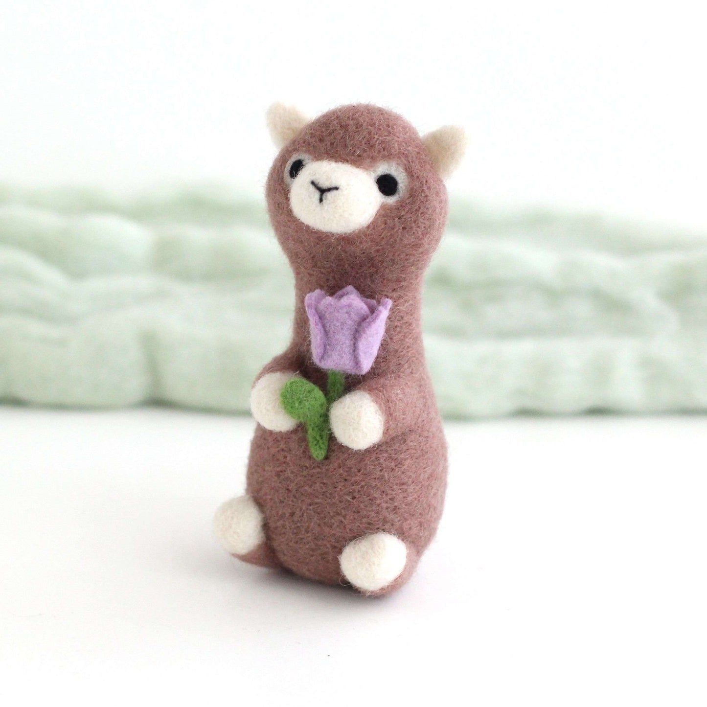 Needle Felted Alpaca holding Purple Tulip