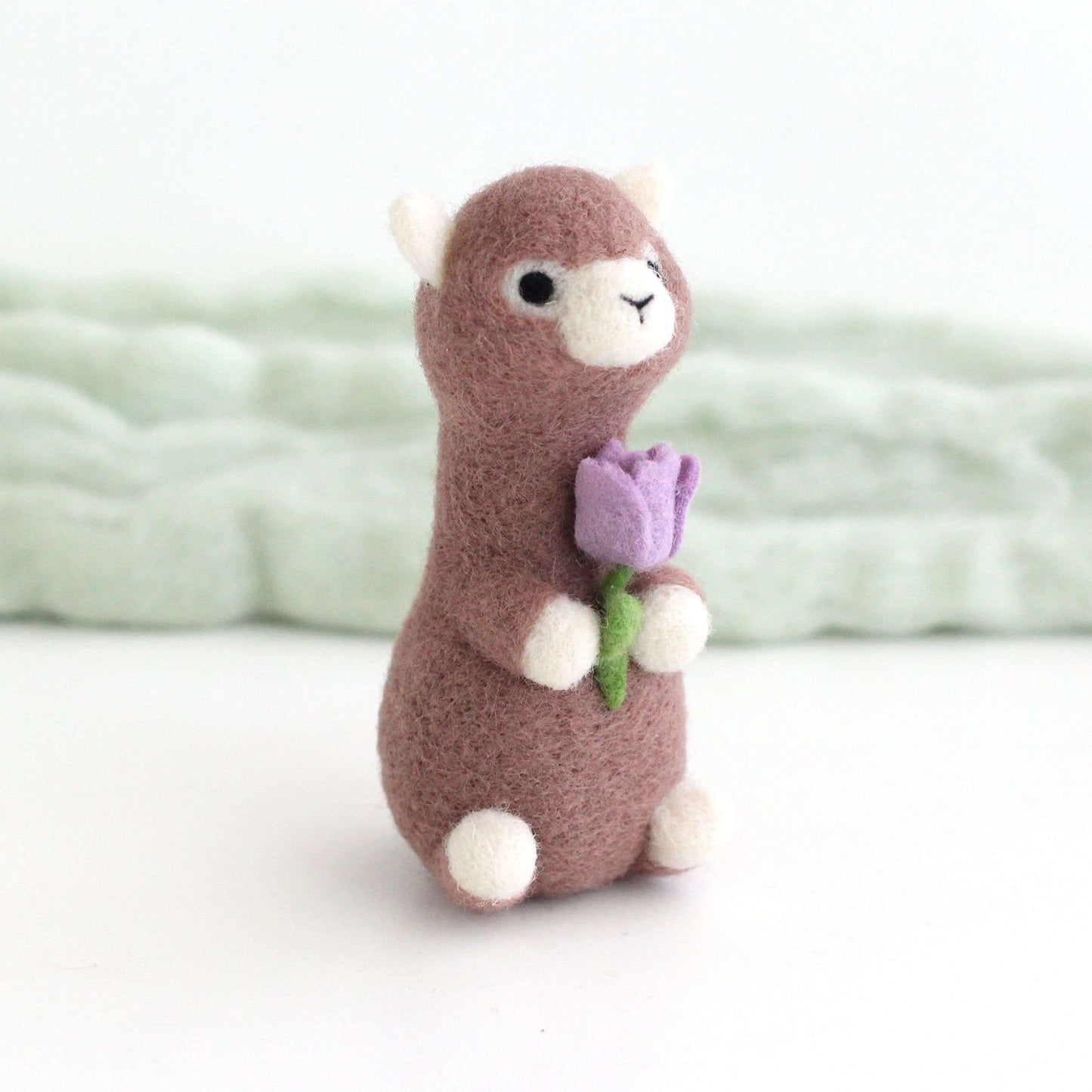Needle Felted Alpaca holding Purple Tulip
