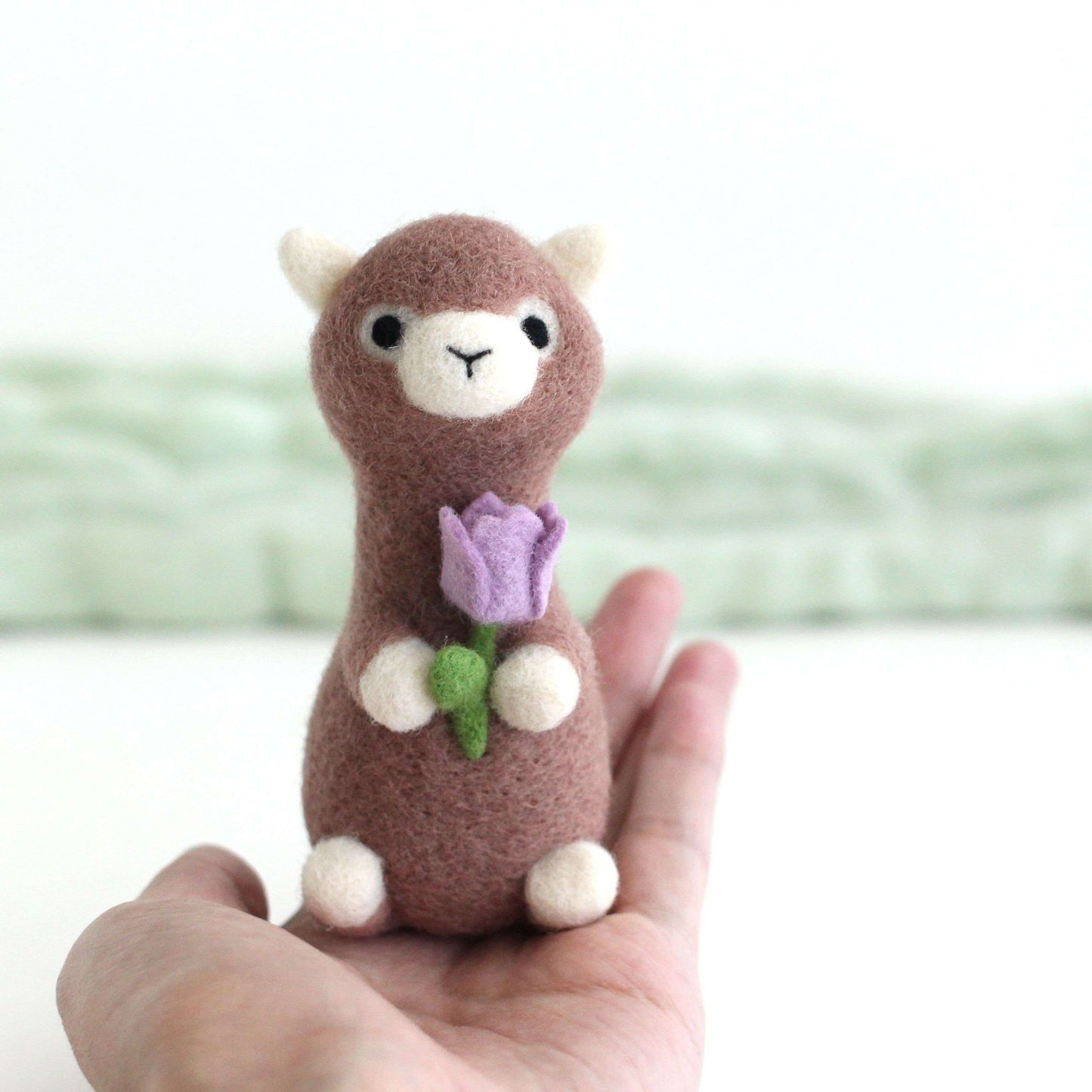 Needle Felted Alpaca holding Purple Tulip