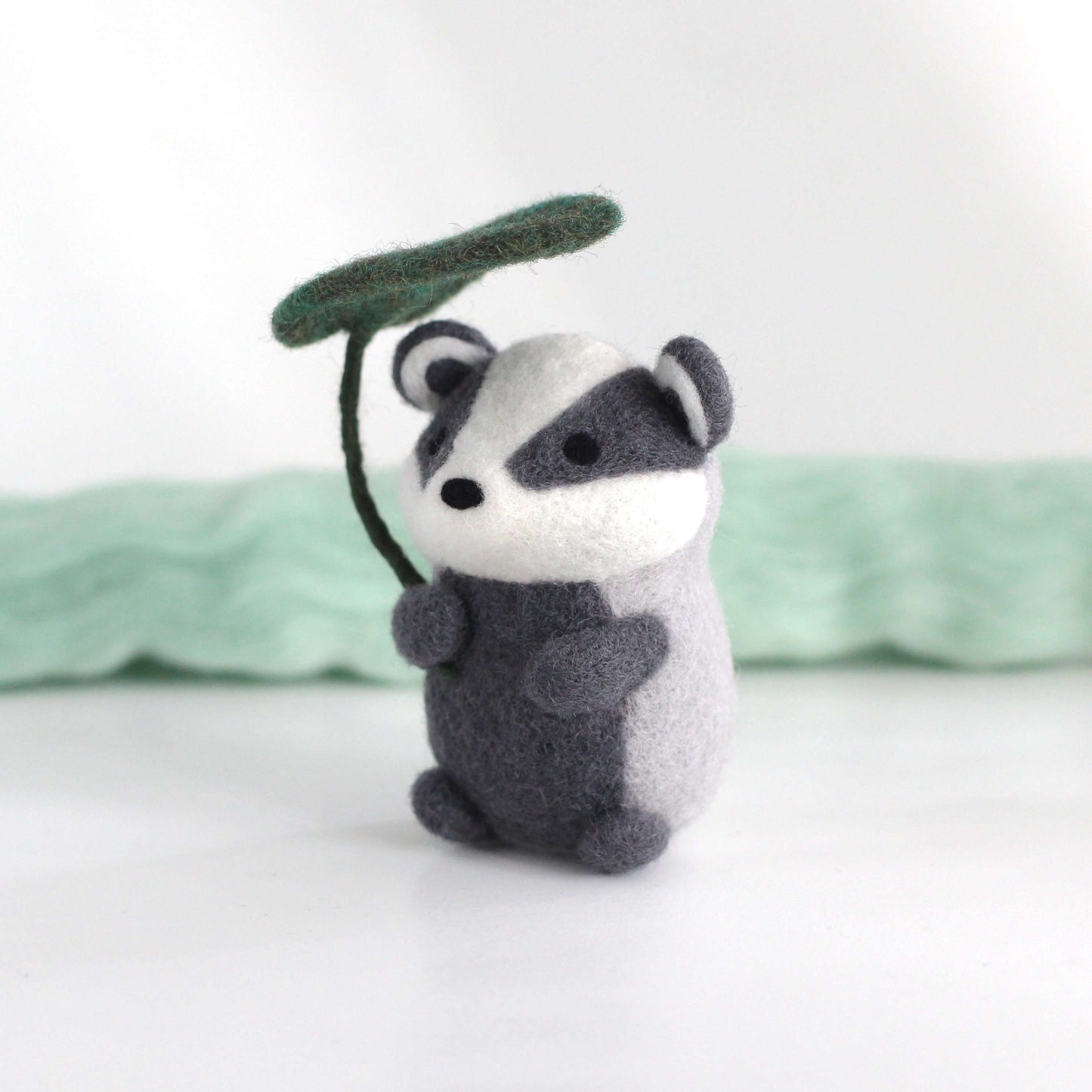 Needle Felted Badger Holding Leaf Umbrella