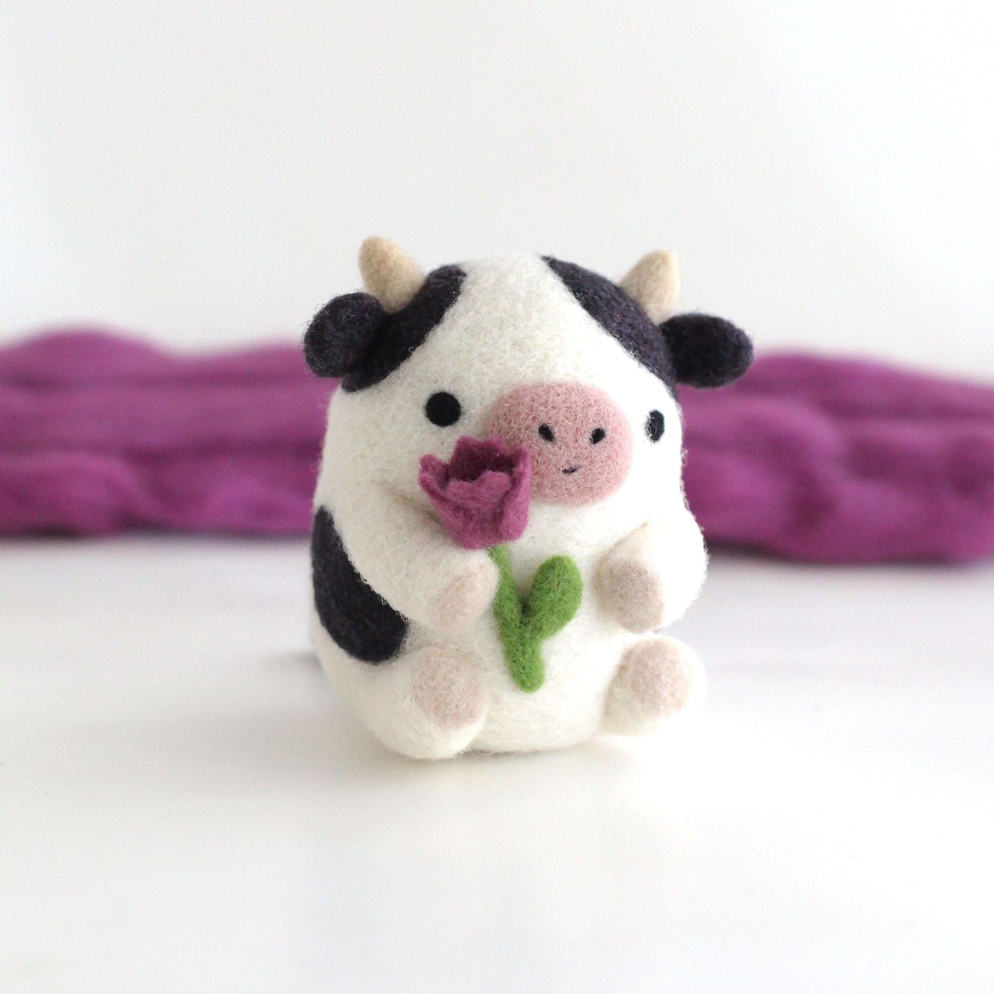 Needle Felted Cow holding Tulip