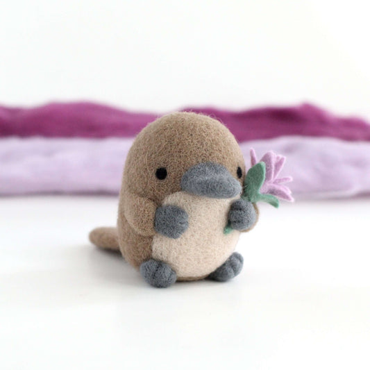 Needle Felted Platypus holding a Wildflower (Light purple)