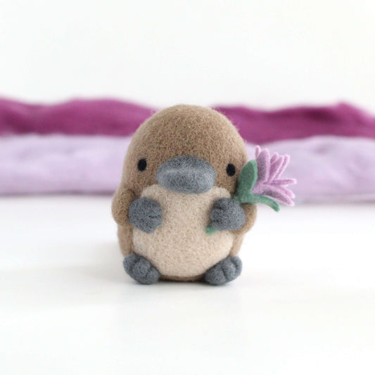 Needle Felted Platypus holding a Wildflower (Light purple)