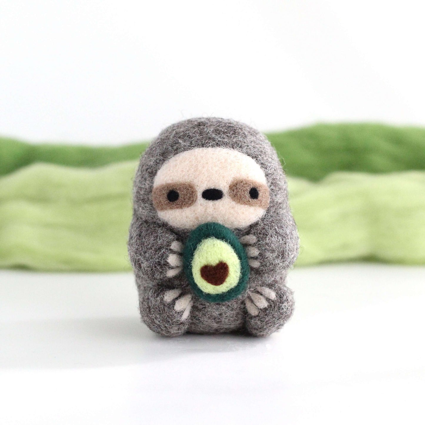 Needle Felted Sloth holding Avocado