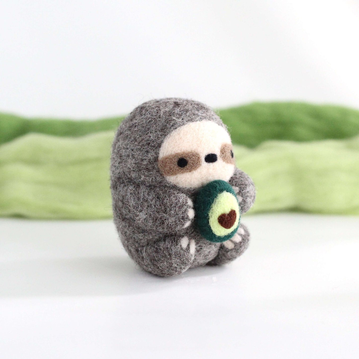 Needle Felted Sloth holding Avocado