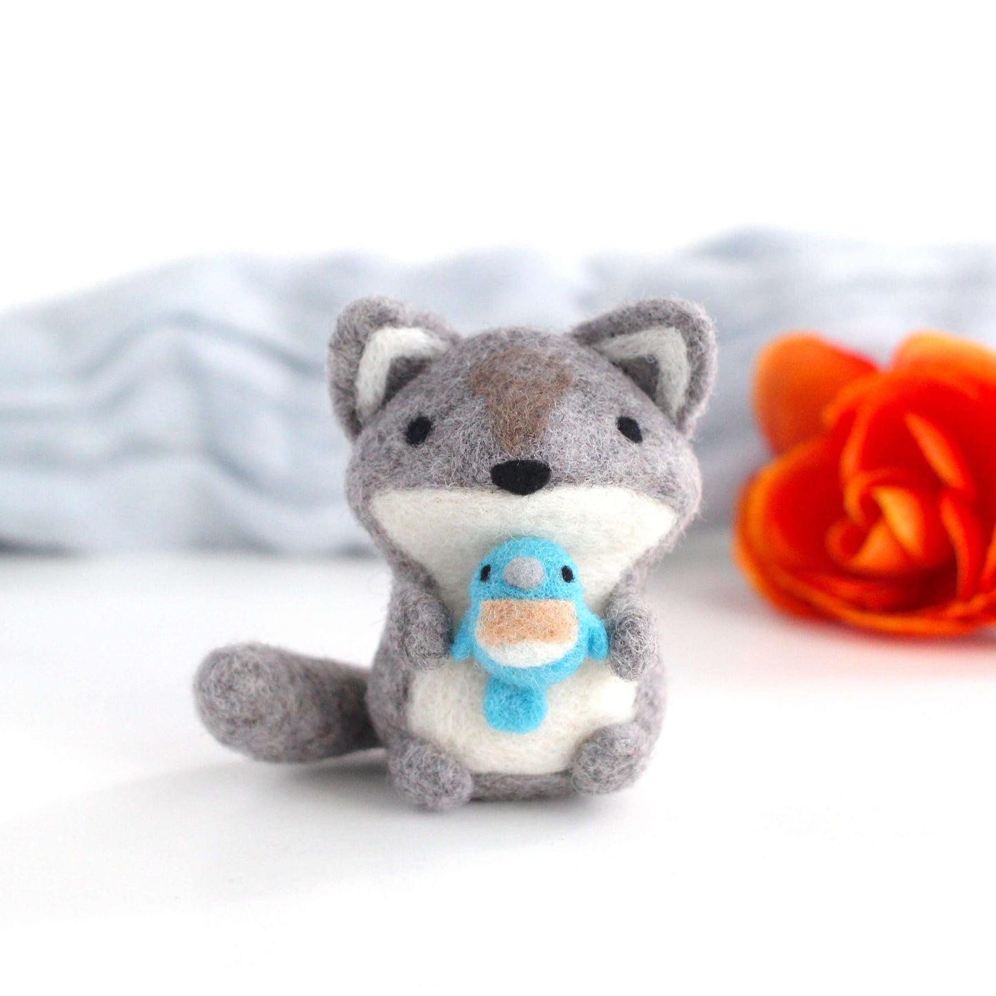 Needle Felted Wolf holding Bluebird