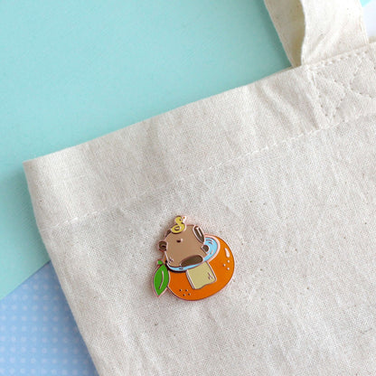 Capybara in Orange Bathtub Enamel Pin