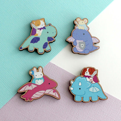 Four colourful animal knights riding dragons wooden magnets with a colourful background