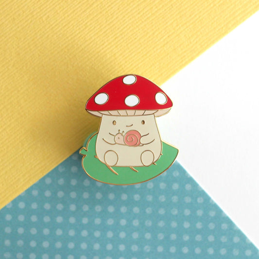 Mushroom on Leaf and holding a Snail Enamel Pin