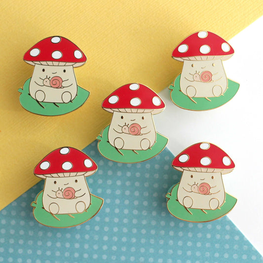 Mushroom on Leaf and holding a Snail Enamel Pin