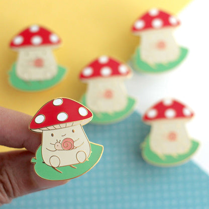 Mushroom on Leaf and holding a Snail Enamel Pin