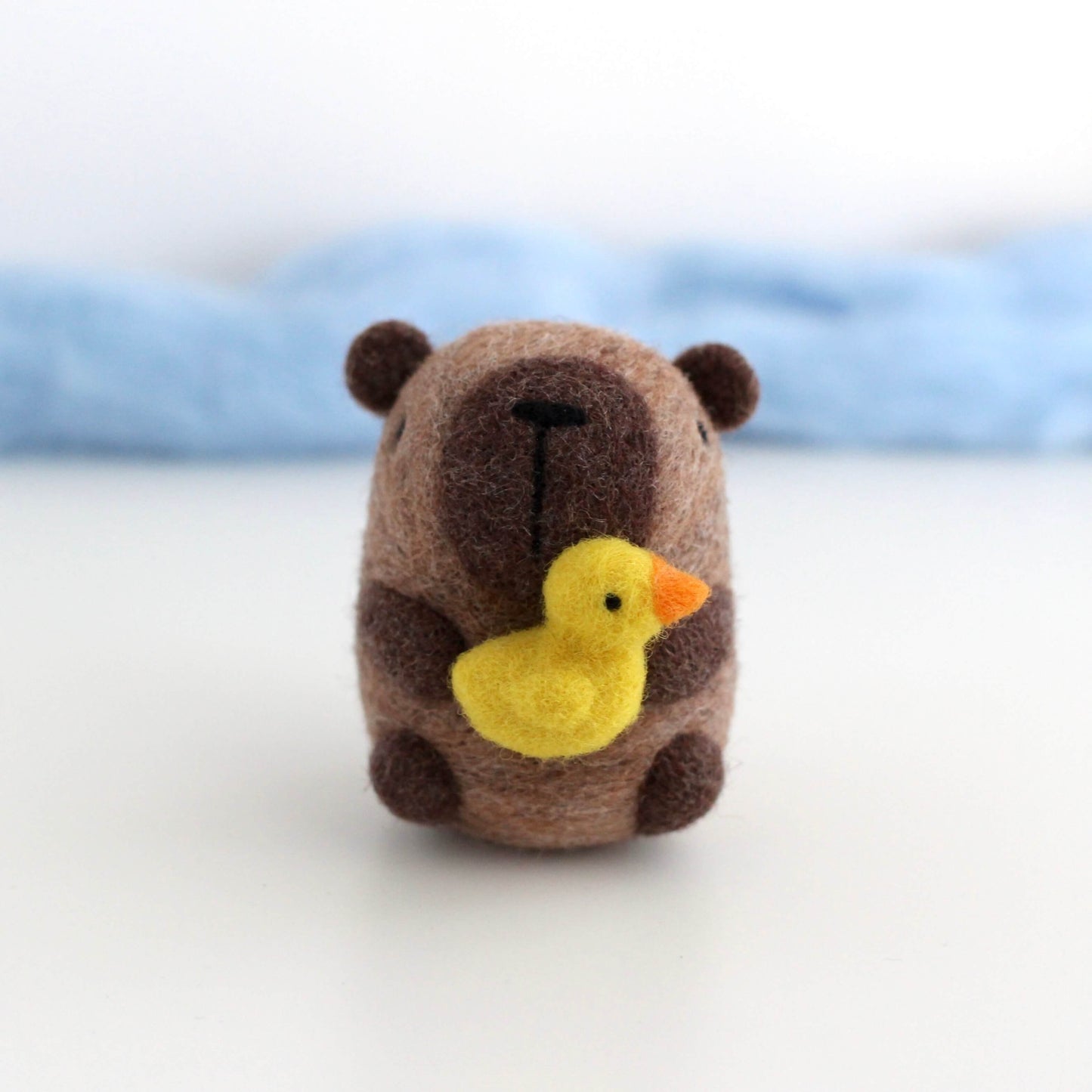 Needle Felted Capybara holding Ducky