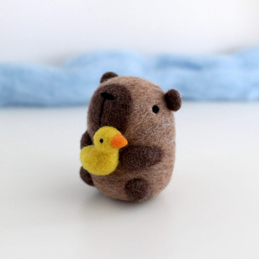 Needle Felted Capybara holding Ducky