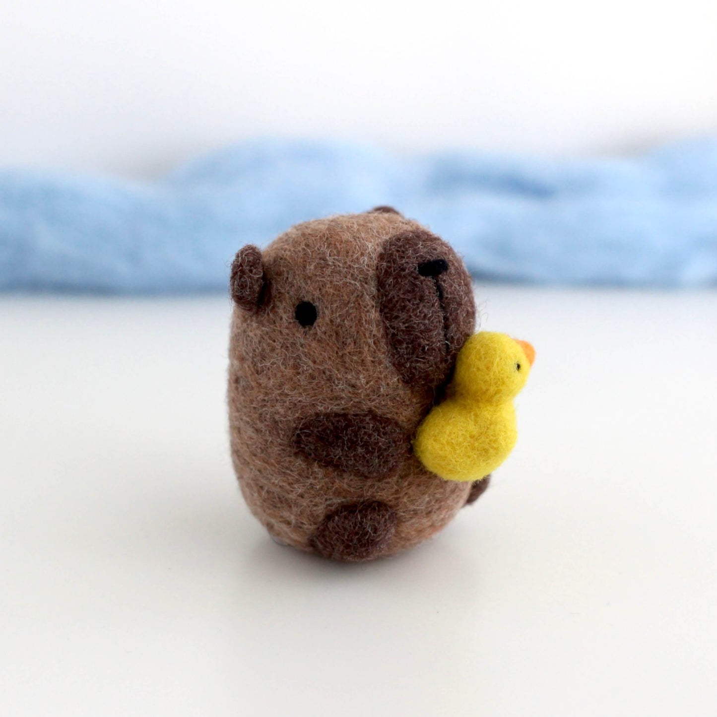 Needle Felted Capybara holding Ducky