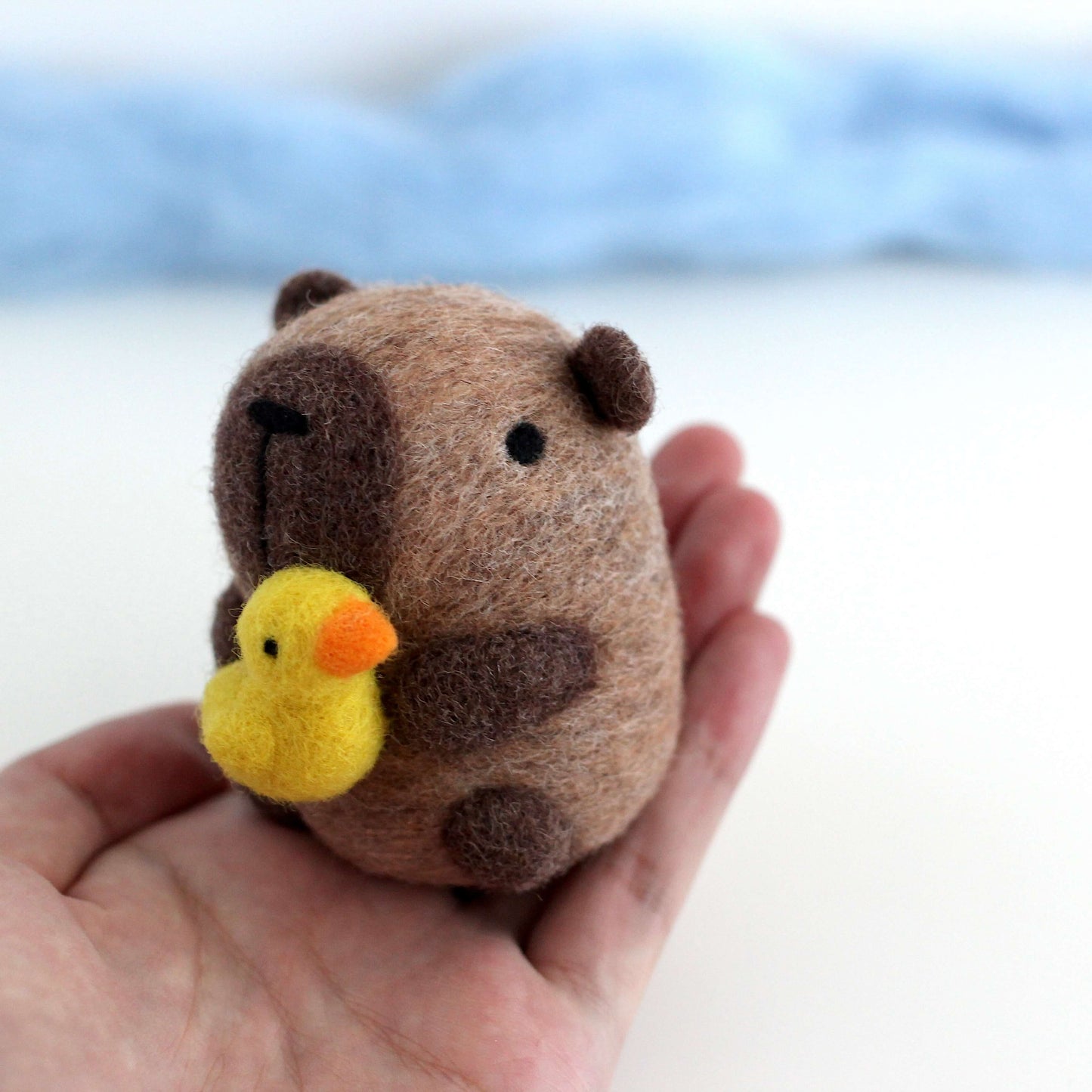 Needle Felted Capybara holding Ducky