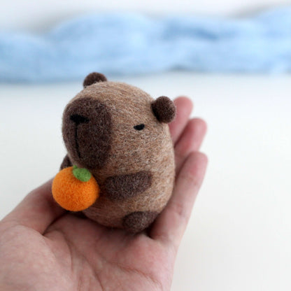 Needle Felted Capybara holding Orange