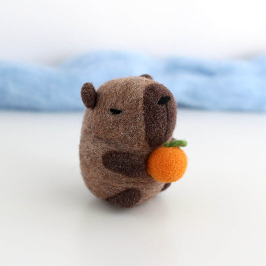 Needle Felted Capybara holding Orange