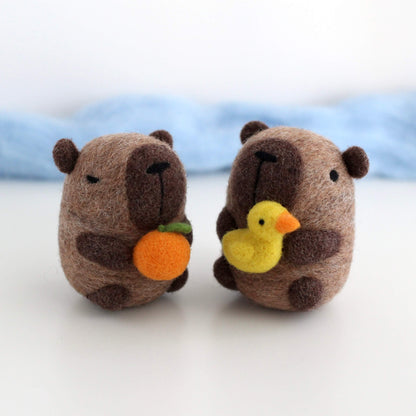 Needle Felted Capybara holding Ducky
