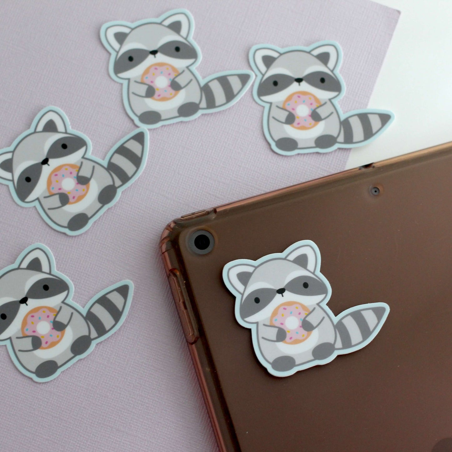 Raccoon holding Donut Vinyl Sticker
