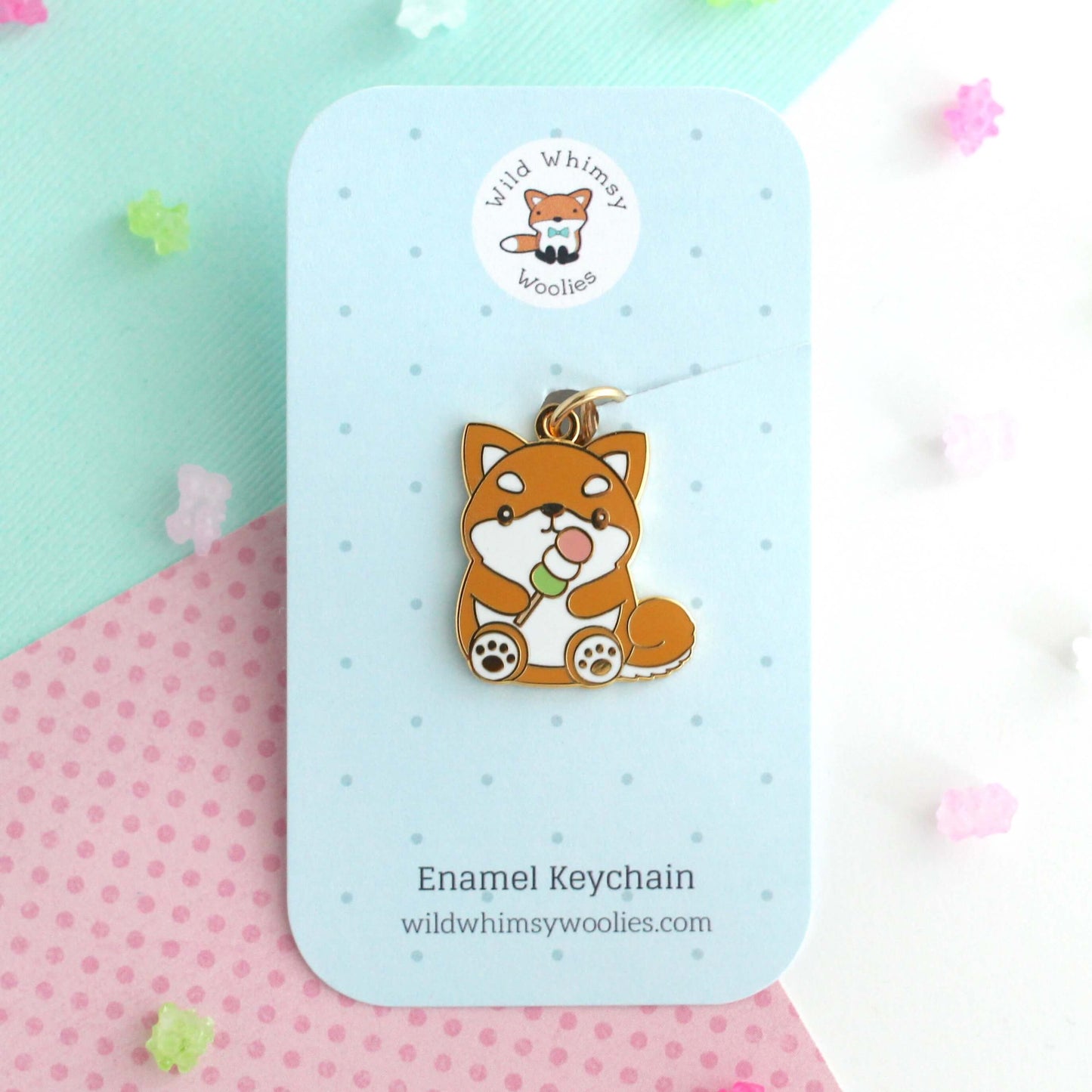 Shiba Inu holding a Dango Enamel Keychain