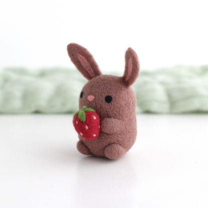 Needle Felted Bunny holding a Strawberry