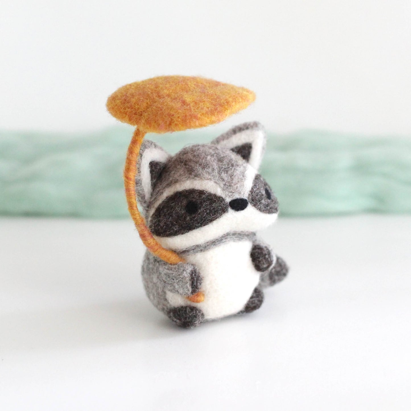 Needle Felted Raccoon Holding Leaf Umbrella by Wild Whimsy Woolies