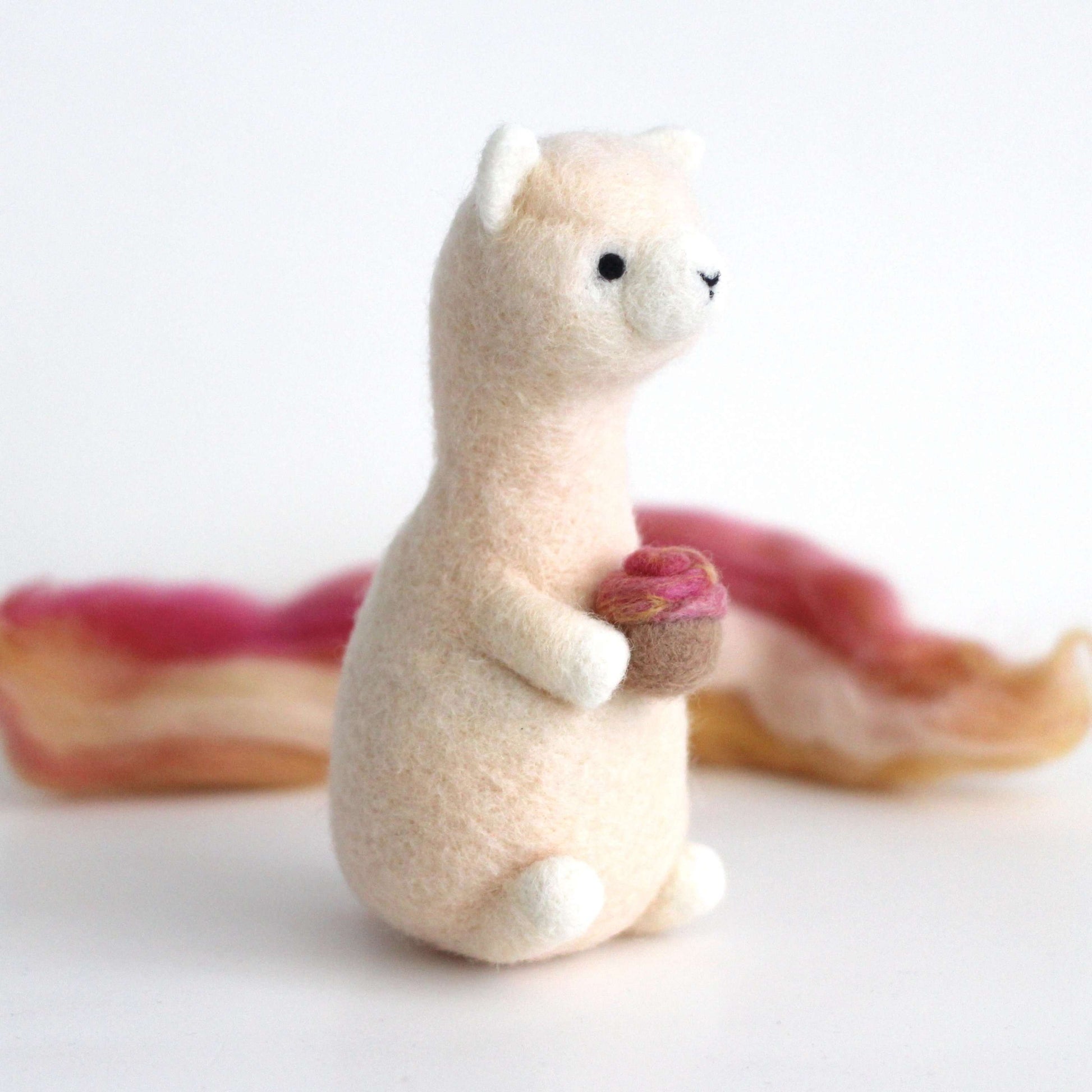 Needle Felted Alpaca holding Cupcake by Wild Whimsy Woolies