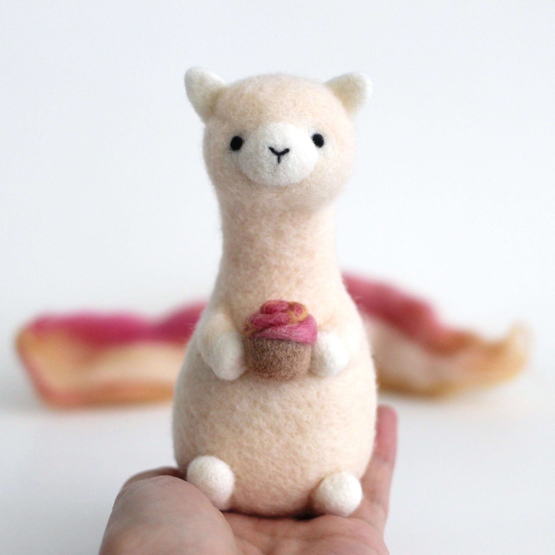 Needle Felted Alpaca holding Cupcake by Wild Whimsy Woolies
