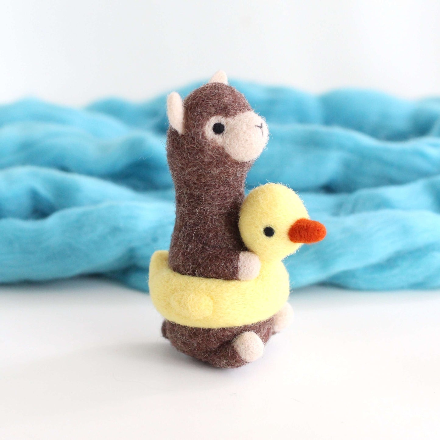 Needle Felted Alpaca in a Duck Floatie by Wild Whimsy Woolies
