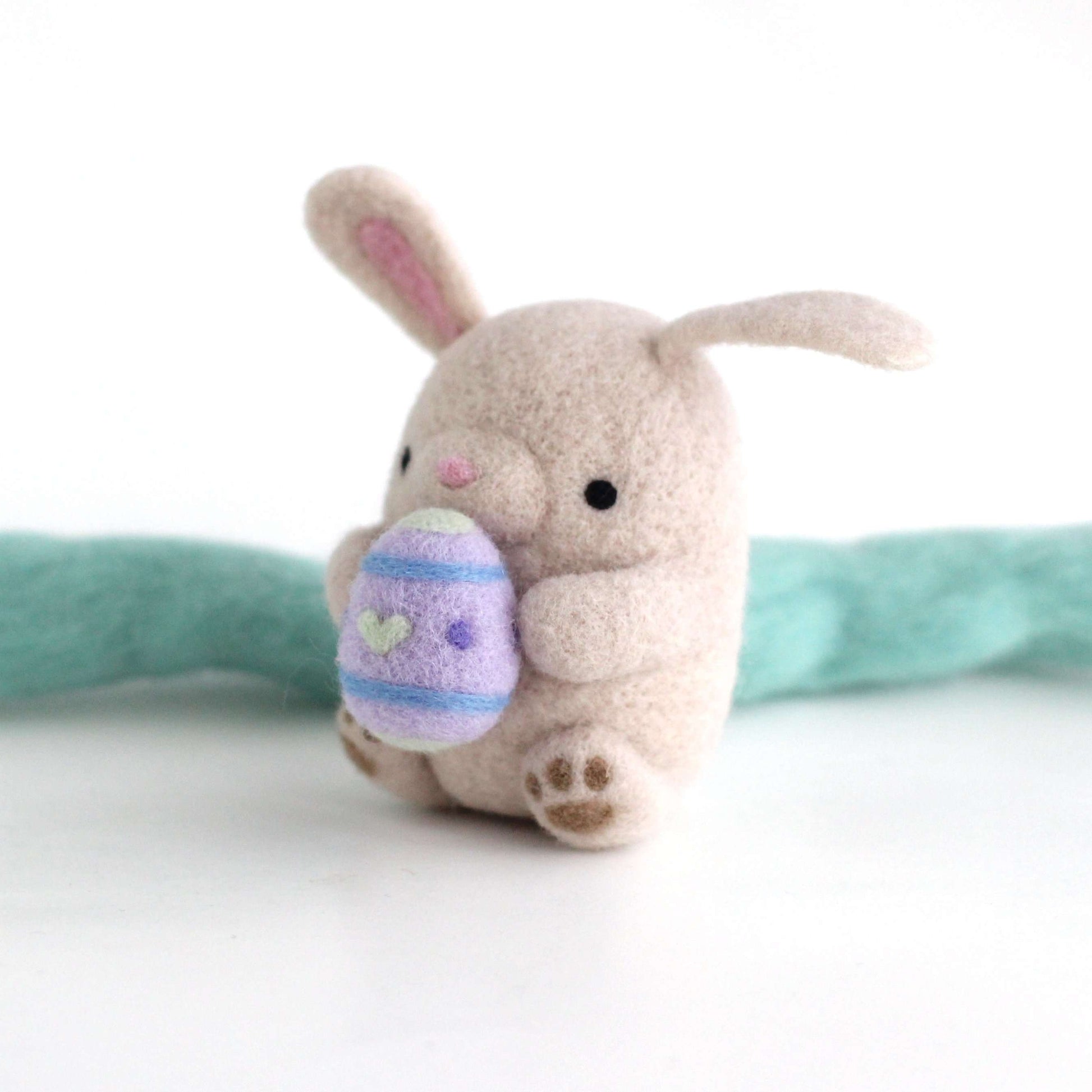 Needle Felted Bunny holding an Easter egg by Wild Whimsy Woolies