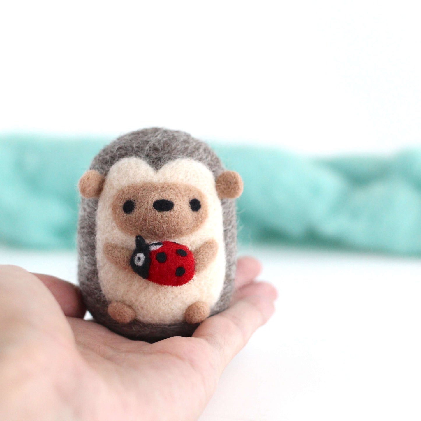 Needle Felted Hedgehog holding Ladybug